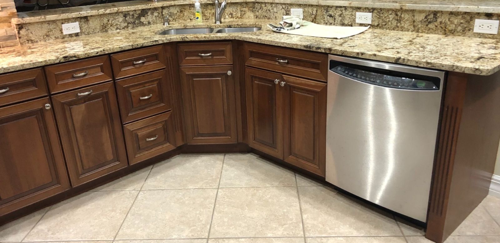 Sink cabinets before: dark stained wood